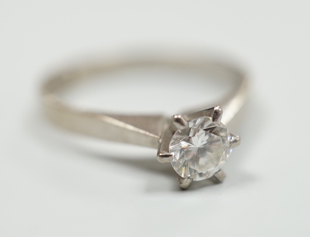 A modern Swedish 18k white metal and solitaire diamond set ring, size K, gross weight 2.6 grams
